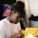 Ypsilanti Community Schools senior Debrieana Jackson cuts letters out for an art piece she is working on during the Student Engagement Summit at the Neutral Zone on Friday, August 23, 2013. Melanie Maxwell | AnnArbor.com